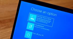 Windows Troubleshoot screen showing repair options; Cloud rebuild is highlighted with a white outline.