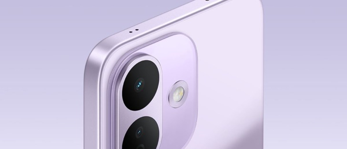 Back view of a light blue Redmi smartphone with a dual-camera module against a pale gradient background.